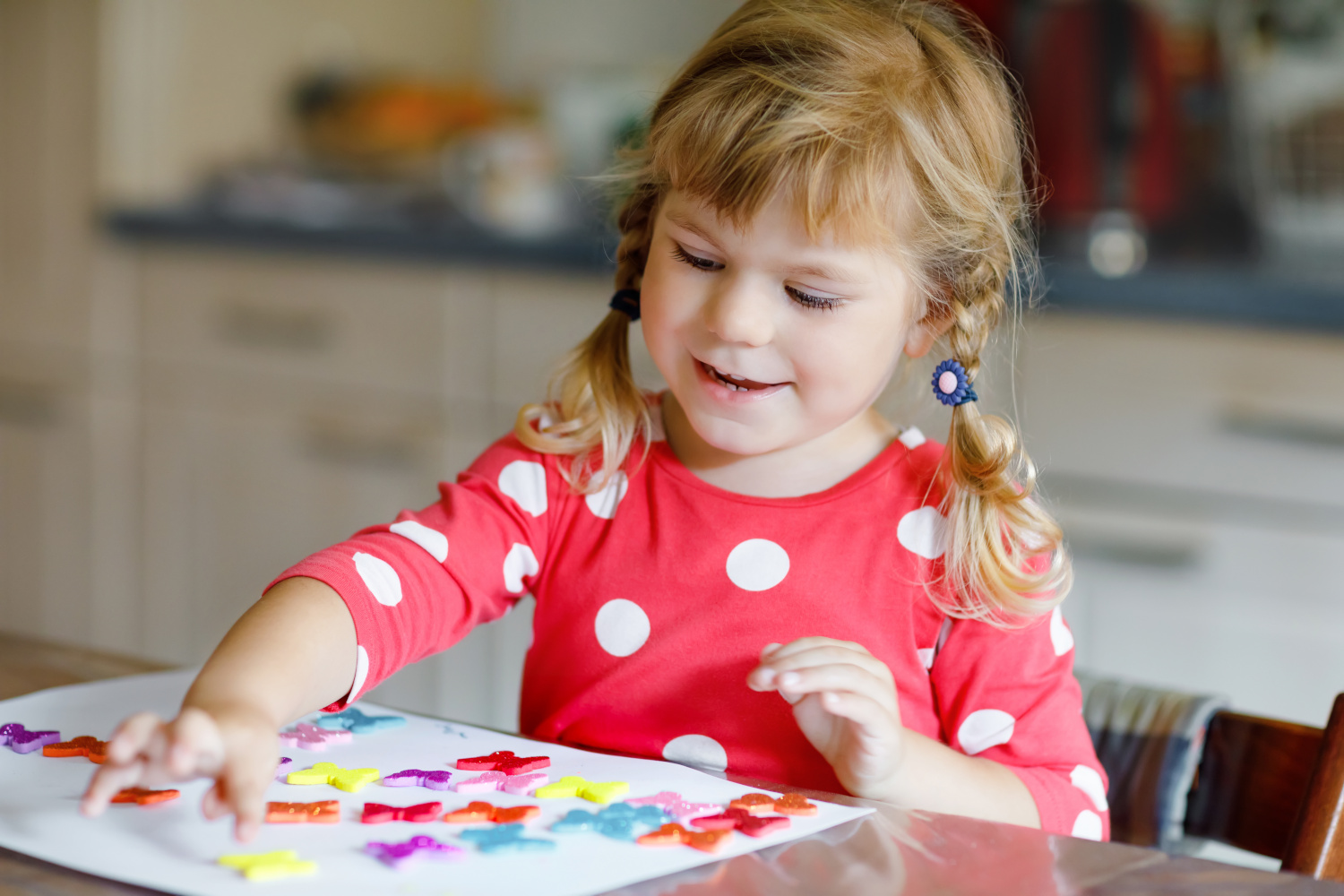 Child Playing With Stickers